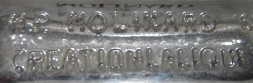 H.P. MOLINARD CREATION LALIQUE molded signature on the underside of a modern Molinard De Molinard Eau De Toilette or Perfume Bottle. The bottle was made by Henri Pochete - H.P.